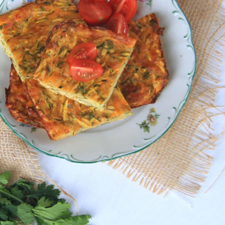 Zucchini fritters with tomatoes