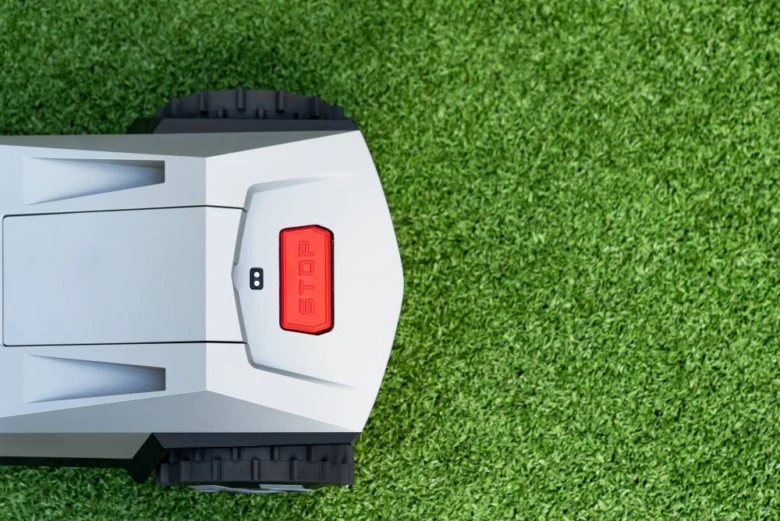 Robotic lawnmower on grass