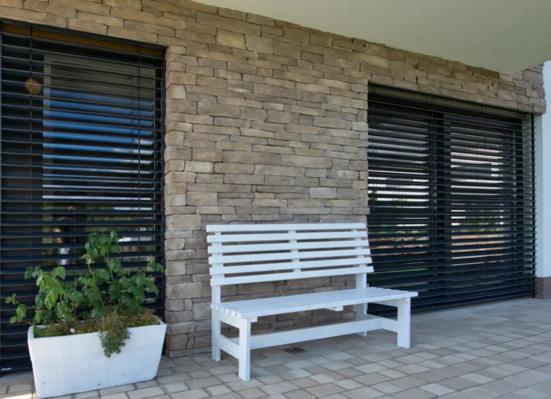 White bench and window shutters