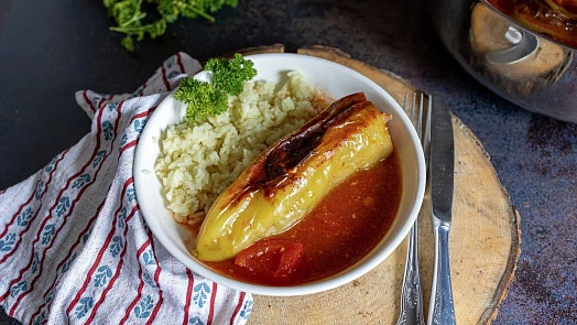 Stuffed peppers with tomato sauce and rice