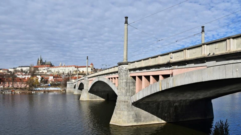 Prague railway bridge over vltava river with prague castle i